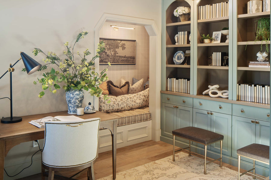 French cushion with tufting and vertical stripes inside a recessed office wall. 